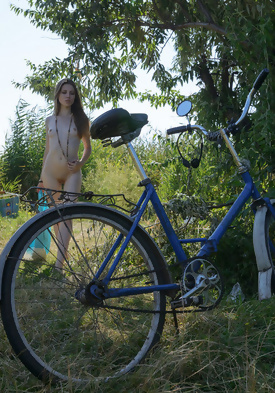 Cute Skinny Coed Naked on a Bicycle