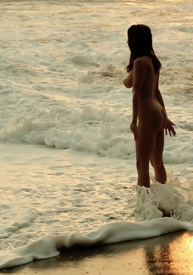 Sofia Webber Strolls Nude On The Beach At Sunset